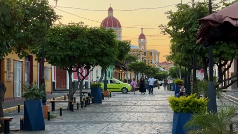 Strolling Through Granadas Charming Streets During Sunset in Nicaragua Stock Footage 305775130