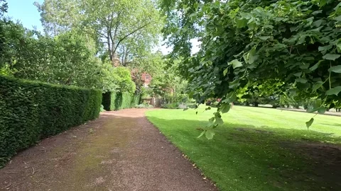 Strolling through the lush gardens of Tyninghame House Stock Footage 313127903