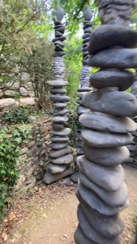 Strolling through a park filled with stone columns in the Cévennes 스톡 동영상 346501105