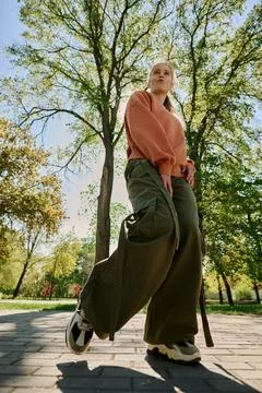 Strolling Through Park Under Bright Sunlight Fotos Stock