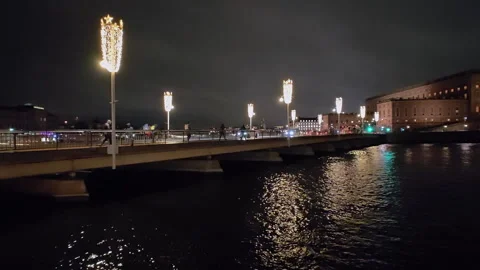 Strömbron bridge spanning Norrström river at night in Stockholm Stock Footage 338390535