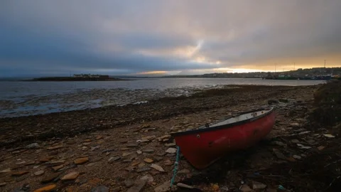 Stromness at sundown with fog rolling over hoy and a small fishing boat  Stock Footage 291663176