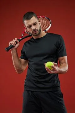 Strong adorable athlete posing at the camera with special tool for playing Stock Photos