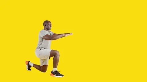 A strong african man doing bouncing lunges Stock Footage 243553053
