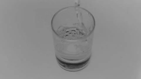 A strong alcoholic drink is poured into a stack. Stock Footage 143654511