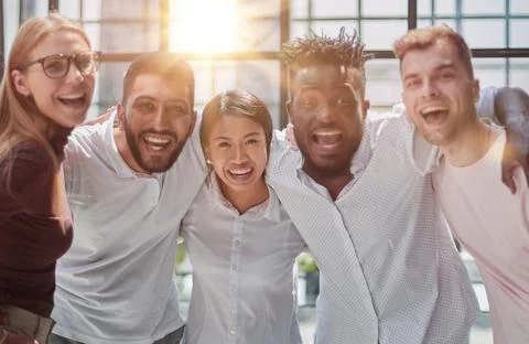 Strong and creative team. Group of business people and smiling at camera Stock Photos