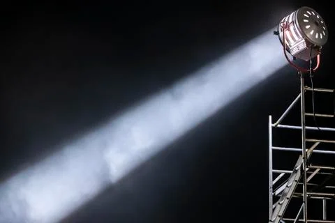 Strong and focused diagonal light ray from a movie lighting spotlight Stock Photos
