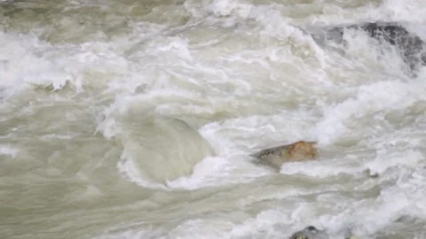 Strong and rapid flow of a mountain river. Power of nature Stock Footage 93539816