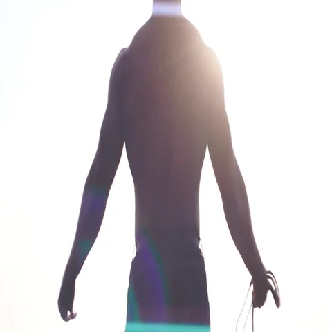 Strong angry black man standing outdoors, taking up and squeezing his hands Stock Footage