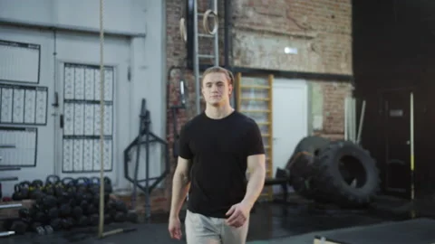 A strong athlete is crossing and looking at the camera Stock Footage 155238509