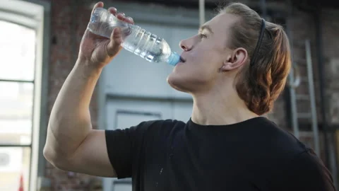 A strong athlete is drinking water Stock Footage 155903798
