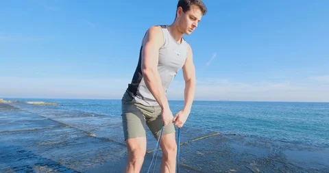 Strong athlete training on beach Stock Footage 122689834