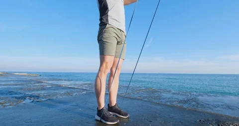 Strong athlete training on beach Stock Footage 122689908