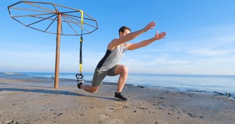 Strong athlete training on beach Stock Footage 122690210