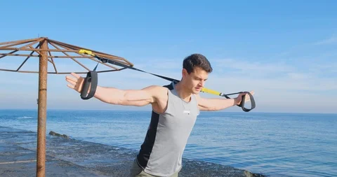 Strong athlete training on beach Stock Footage 122690485