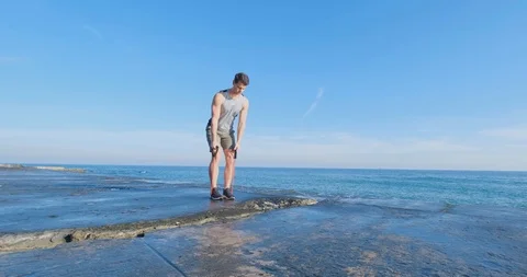 Strong athlete training on beach Stock Footage 122690596