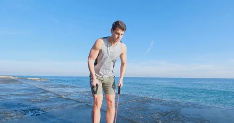 Strong athlete training on beach Stock Footage 122690655