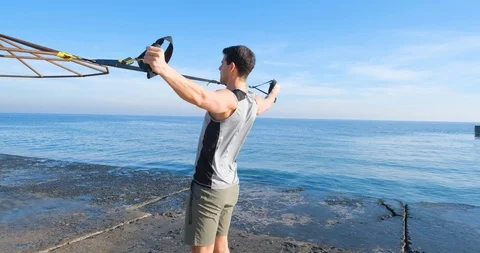 Strong athlete training on beach Stock Footage 122690785