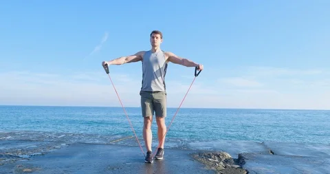 Strong athlete training on beach Stock Footage 122690807