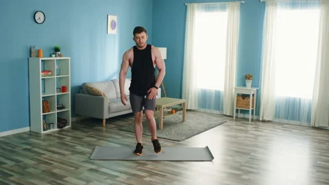 Strong Athlete is Warming Up Looking at Camera Stock Footage 135533953