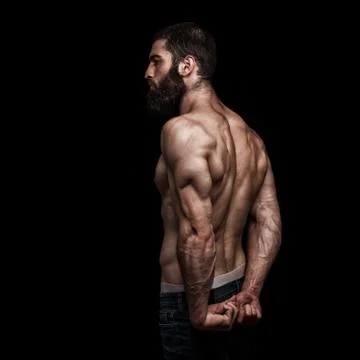 Strong athletic beardy mans back isolated Stock Photos