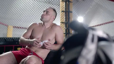 Strong athletic good looking man eat healthy food at gym and pumping up muscles Stock Footage 155651030