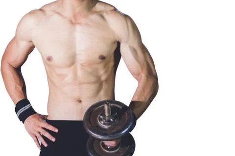 Strong athletic man Doing Exercises With Dumbbells in local gym Stock Photos