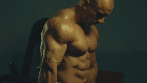 Strong athletic man pumping up biceps muscles workout fitness and bodybuilding Video stock 118775164