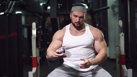 Strong athletic man pumping up muscles workout bodybuilding Video stock 100033718