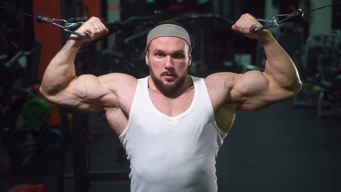 Strong athletic man pumping up muscles workout bodybuilding Video stock 100033894