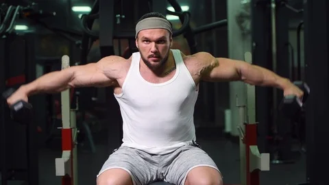 Strong athletic man pumping up muscles workout bodybuilding Video stock 100052137