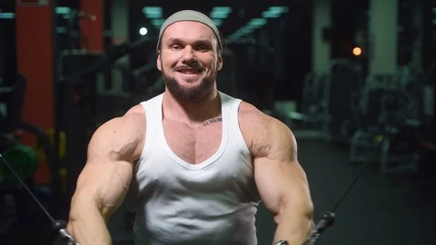 Strong athletic man pumping up muscles workout bodybuilding Video stock 100052188
