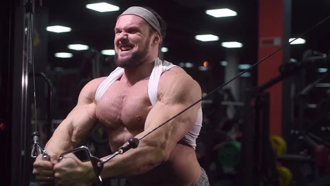 Strong athletic man pumping up muscles workout bodybuilding Video stock 100052256