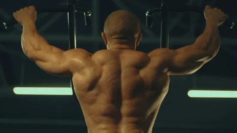 Strong athletic men pumping up back muscles workout fitness and bodybuilding Stock Footage 118776305