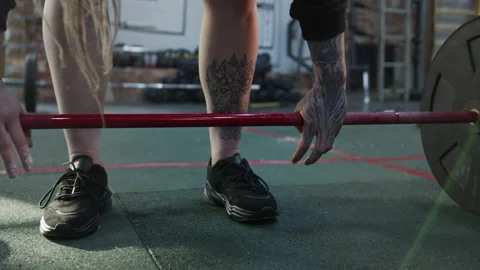 A strong athletic woman is making an exercise with a barbell Video stock 155249334