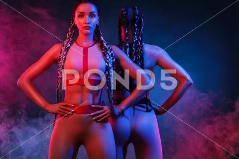 A strong athletic, women on color background wearing in the fashion sportswear Stock-Fotos