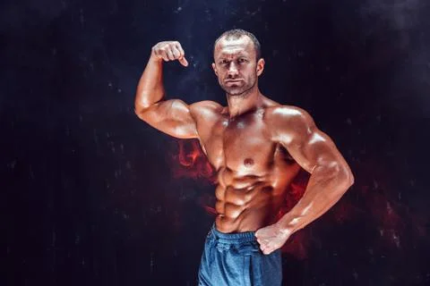 Strong bald bodybuilder with six pack. Stock Photos