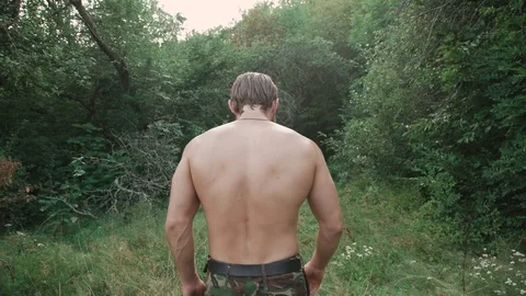 The strong bearded fighter runs in the forest. 4K Stock Footage 80530097