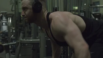 Strong bodybuilder man doing back workout, bent over rows Stock Footage 85655923