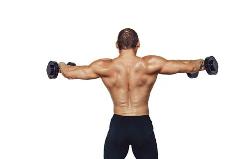 Strong bodybuilder man doing exercises with dumbbells while showing his back on Stock Photos