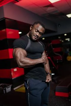 Strong bodybuilder with powerful muscles posing for camera. Healthy handsome  Stock Photos