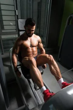 Strong Bodybuilder Training Quads Stock Photos