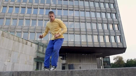 Strong Break Dancer Spinning In The Empty Parking Lot Stock Footage 87709728