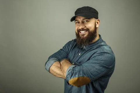 Strong brutal smiling man with a beard Stock Photos