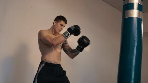 Strong caucasian man boxing using punch sake Stock Footage 101307376