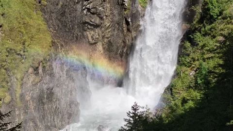Strong Continuous Flow Of Glacial Meltwater In The Swiss Alps Creating A Stock Footage 345256056