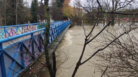 The strong current of the Arga River hits the Plazaola Bridge. Stock Footage 273256718