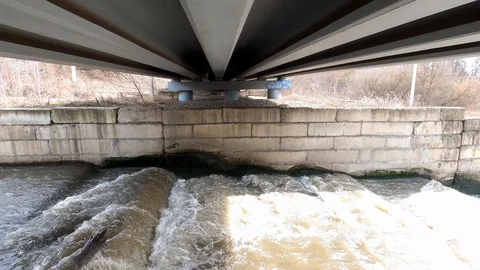 Strong current under the road bridge. Stock Footage 126333337