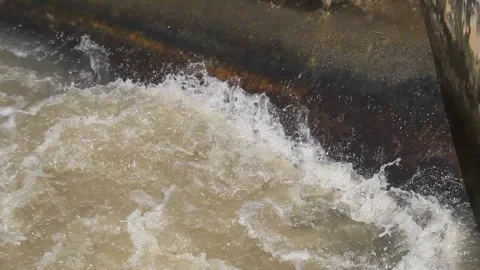 Strong current of water hitting the wall Stock Footage 312687358