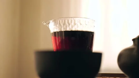 Strong dark Pu-erh tea brewed in a special glass bowl. Chinese tea ceremony. Видео 218447853